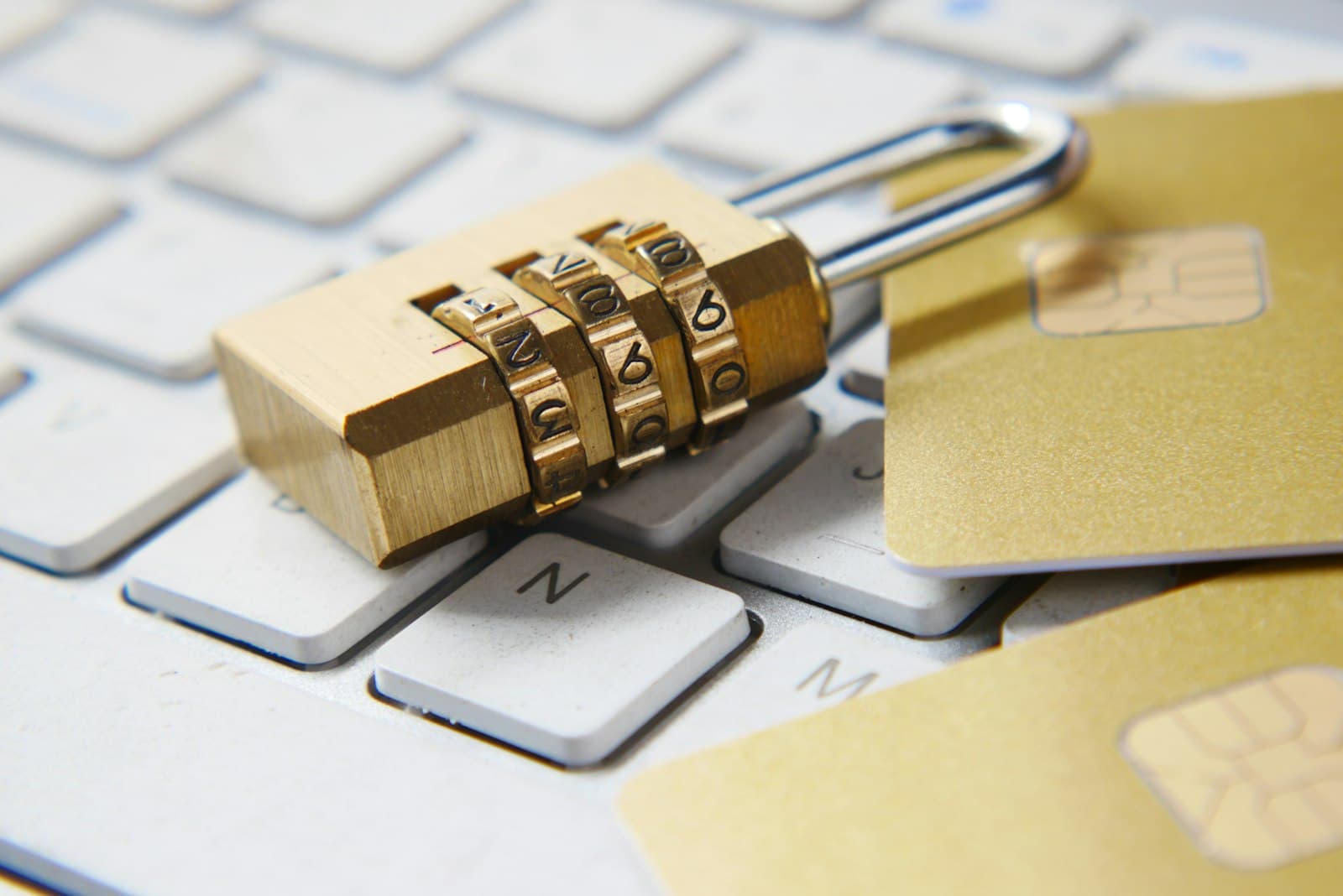 Golden padlock resting on a keyboard symbolizing data protection