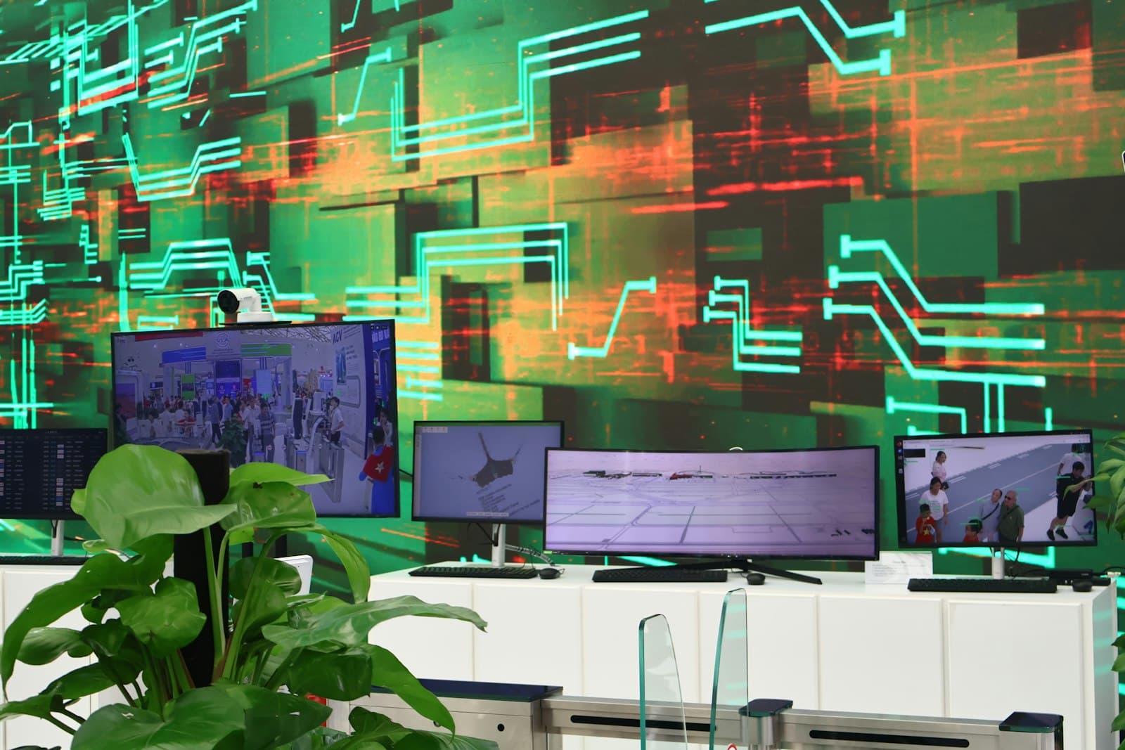 Digital screens displaying data visualization on a circuit board background